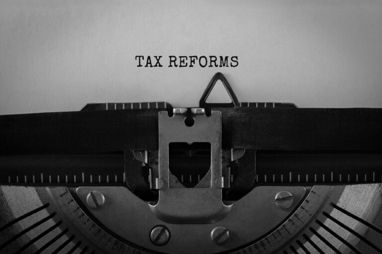 Text Tax Reforms Typed On Retro Typewriter